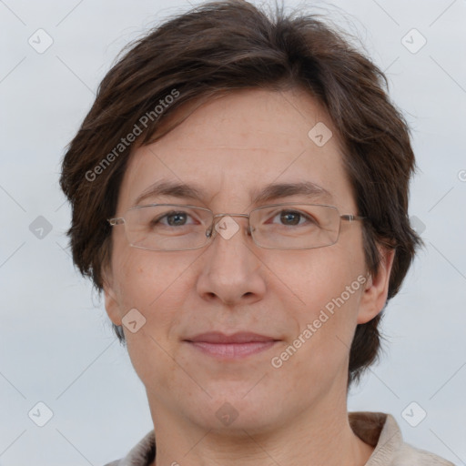 Joyful white adult female with short  brown hair and brown eyes