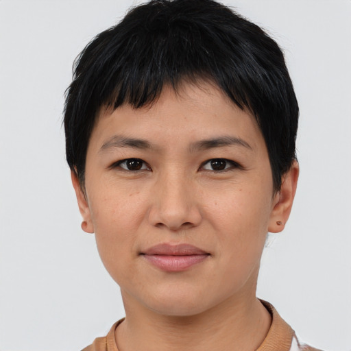 Joyful asian young-adult female with short  black hair and brown eyes