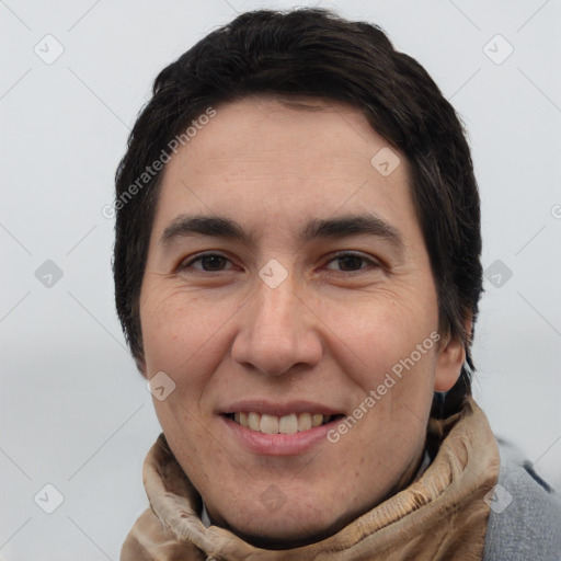 Joyful white adult male with short  brown hair and brown eyes