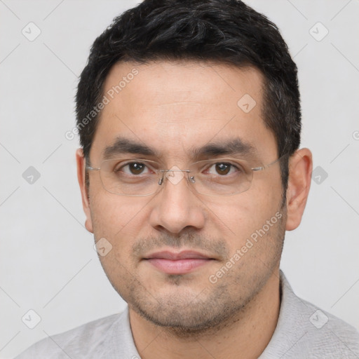 Joyful white young-adult male with short  black hair and brown eyes