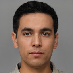 Neutral latino young-adult male with short  brown hair and brown eyes