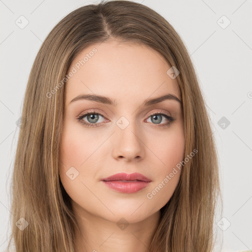 Neutral white young-adult female with long  brown hair and green eyes