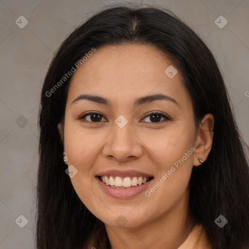 Joyful latino young-adult female with long  brown hair and brown eyes