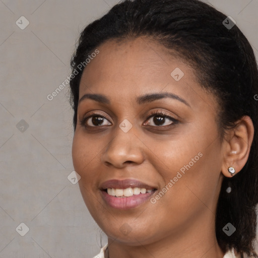 Joyful black young-adult female with medium  black hair and brown eyes