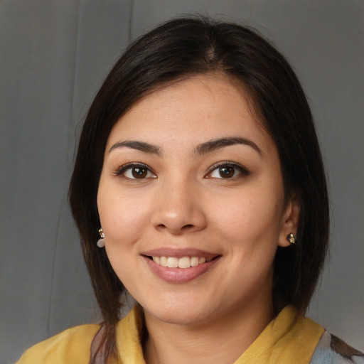 Joyful white young-adult female with medium  brown hair and brown eyes