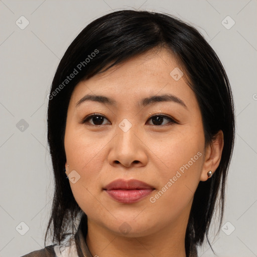 Joyful asian young-adult female with medium  black hair and brown eyes