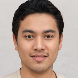 Joyful asian young-adult male with short  brown hair and brown eyes