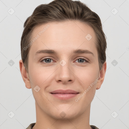 Joyful white young-adult female with short  brown hair and grey eyes