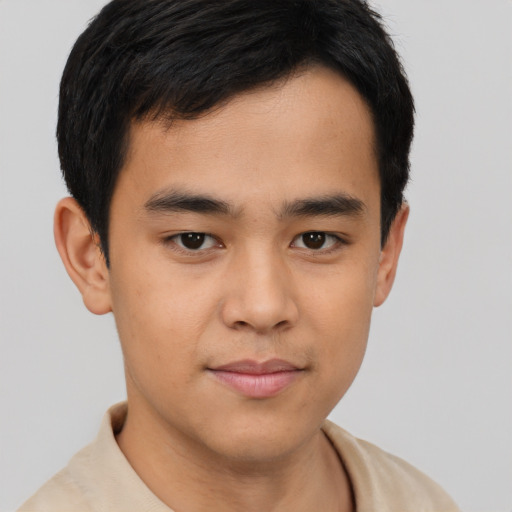 Joyful asian young-adult male with short  brown hair and brown eyes