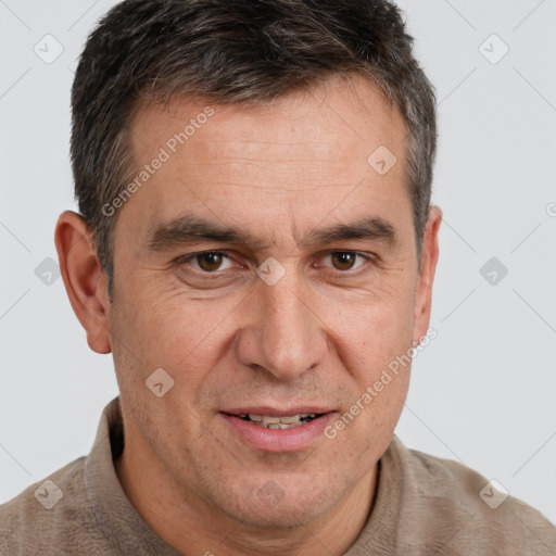 Joyful white adult male with short  brown hair and brown eyes