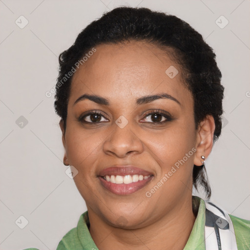 Joyful latino young-adult female with short  black hair and brown eyes