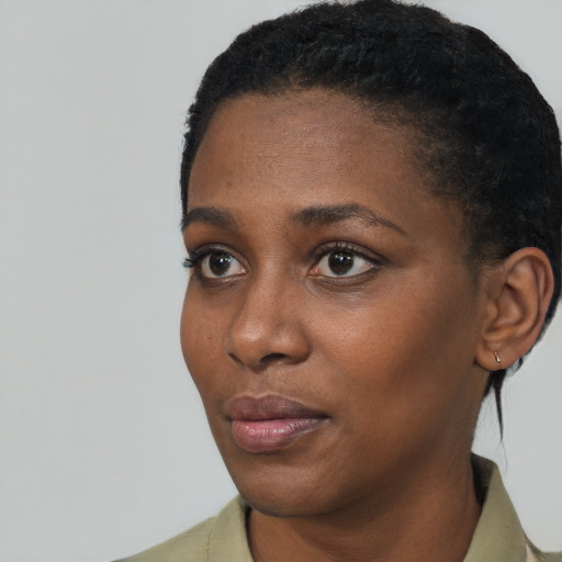 Neutral black young-adult female with short  black hair and brown eyes