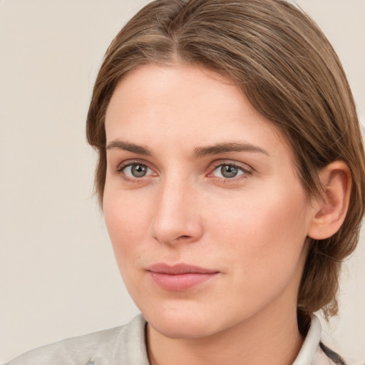 Neutral white young-adult female with medium  brown hair and green eyes