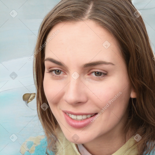 Joyful white young-adult female with medium  brown hair and blue eyes