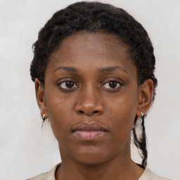 Neutral black young-adult female with short  brown hair and brown eyes