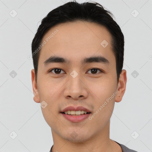 Joyful asian young-adult male with short  black hair and brown eyes