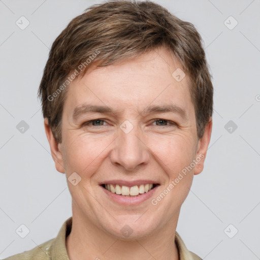 Joyful white adult male with short  brown hair and grey eyes