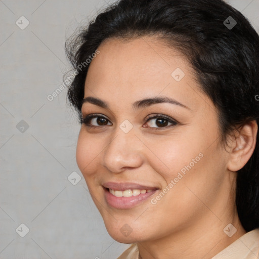 Joyful latino young-adult female with medium  brown hair and brown eyes