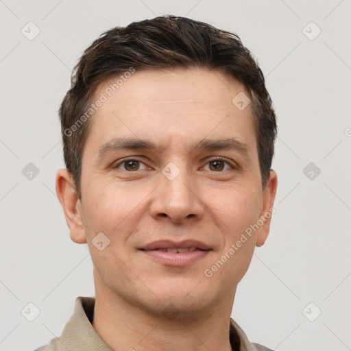 Joyful white young-adult male with short  brown hair and brown eyes