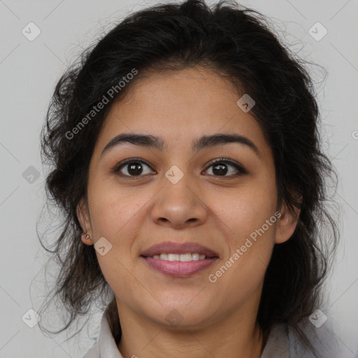 Joyful latino young-adult female with long  brown hair and brown eyes