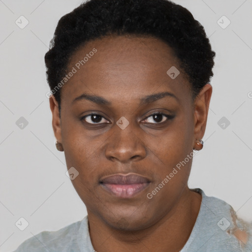 Joyful black young-adult female with short  black hair and brown eyes