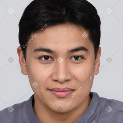 Joyful asian young-adult male with short  brown hair and brown eyes