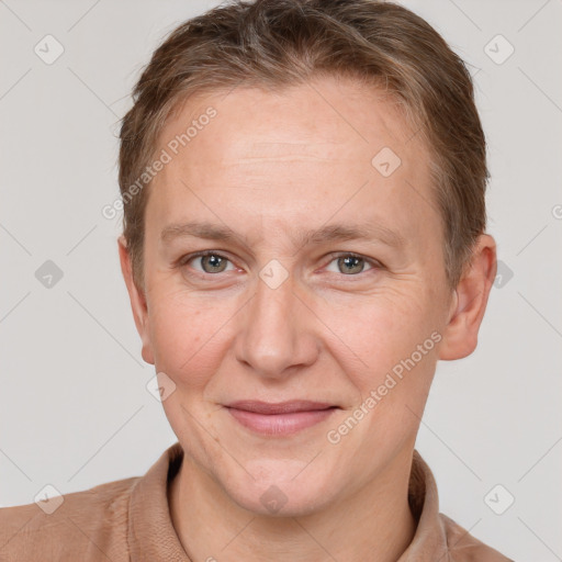 Joyful white adult female with short  brown hair and grey eyes