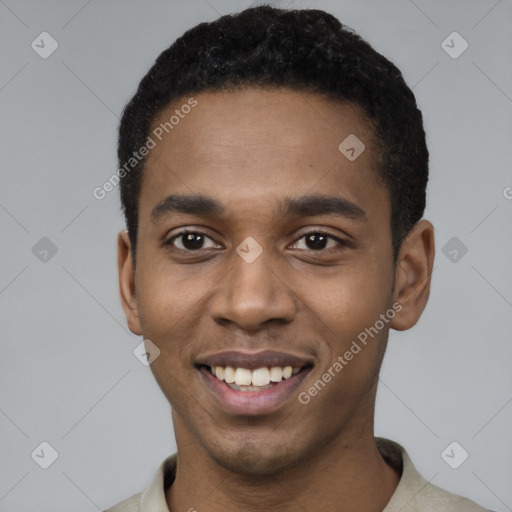 Joyful black young-adult male with short  black hair and brown eyes