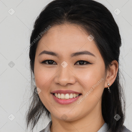 Joyful asian young-adult female with long  brown hair and brown eyes