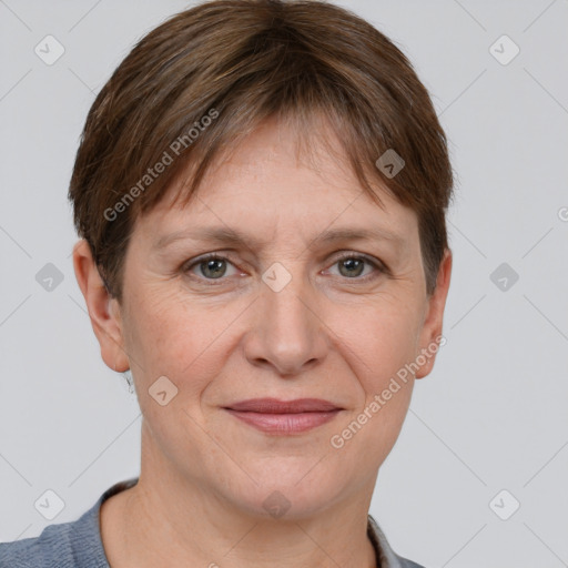 Joyful white adult female with short  brown hair and grey eyes