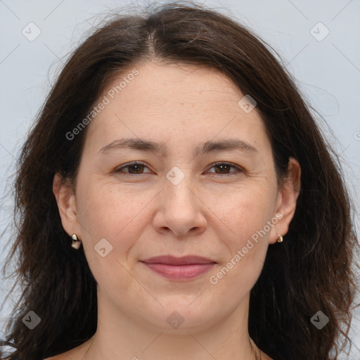 Joyful white adult female with long  brown hair and brown eyes