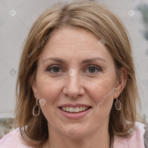 Joyful white adult female with medium  brown hair and grey eyes