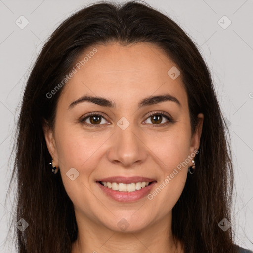 Joyful white young-adult female with long  brown hair and brown eyes