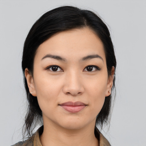Joyful asian young-adult female with medium  black hair and brown eyes