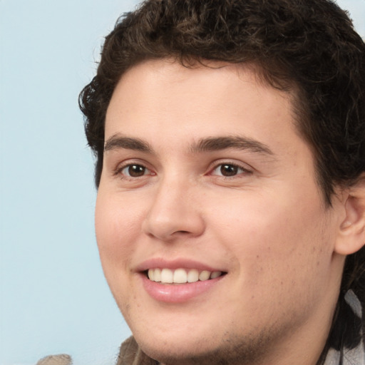 Joyful white young-adult male with medium  brown hair and brown eyes