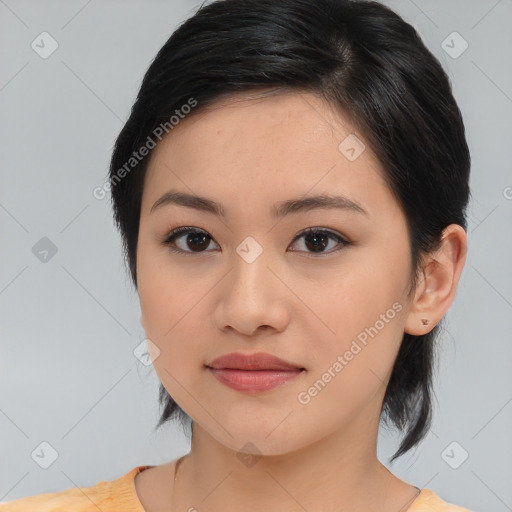 Joyful asian young-adult female with medium  black hair and brown eyes