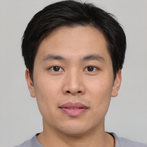 Neutral asian young-adult male with short  brown hair and brown eyes