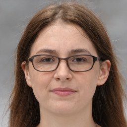 Joyful white adult female with long  brown hair and brown eyes