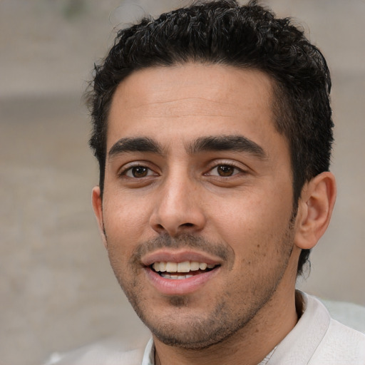 Joyful white young-adult male with short  black hair and brown eyes