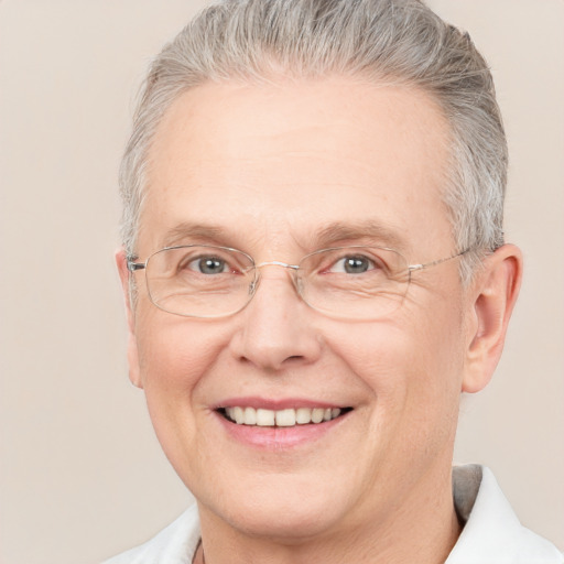 Joyful white middle-aged male with short  gray hair and brown eyes