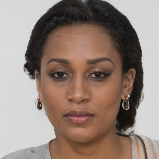 Neutral black young-adult female with short  black hair and brown eyes