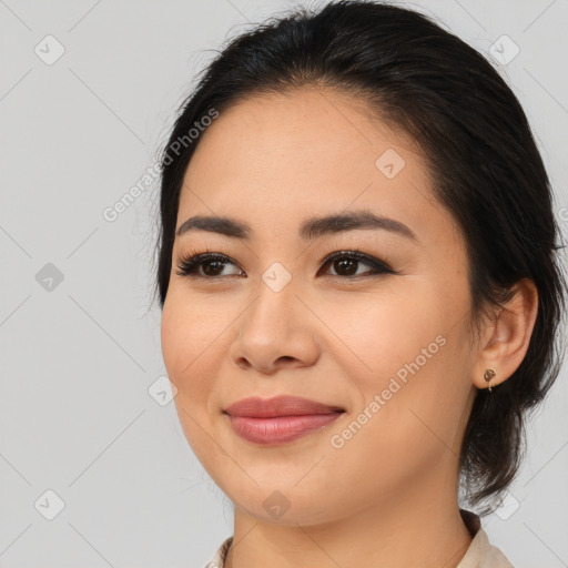 Joyful latino young-adult female with medium  brown hair and brown eyes