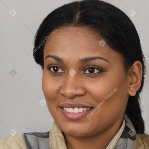 Joyful black young-adult female with short  brown hair and brown eyes