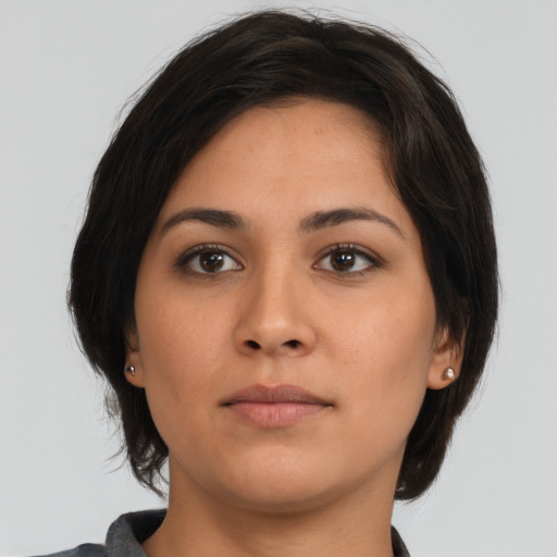 Neutral asian young-adult female with medium  brown hair and brown eyes
