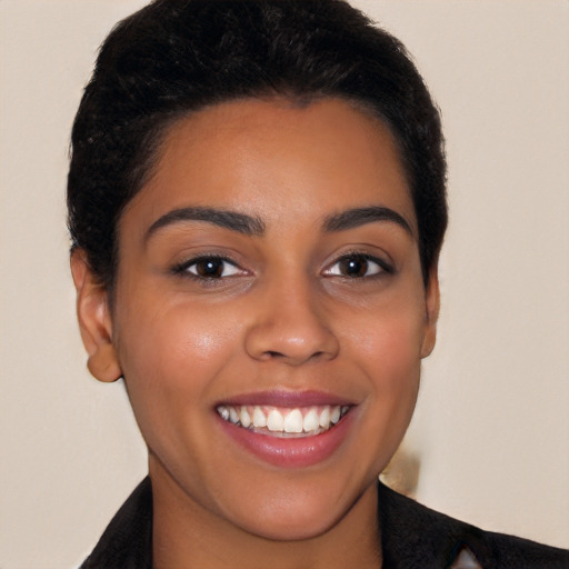 Joyful latino young-adult female with short  brown hair and brown eyes