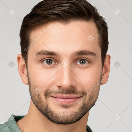 Joyful white young-adult male with short  brown hair and brown eyes