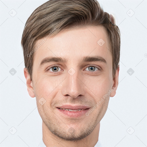 Joyful white young-adult male with short  brown hair and grey eyes