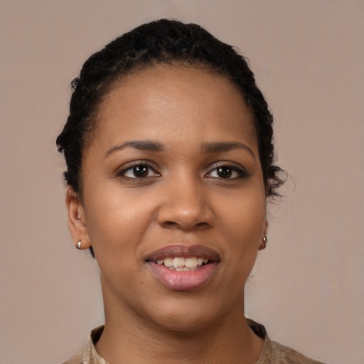 Joyful black young-adult female with short  brown hair and brown eyes
