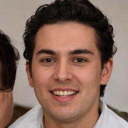 Joyful white young-adult male with medium  brown hair and brown eyes