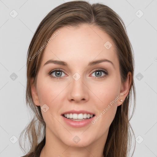 Joyful white young-adult female with long  brown hair and blue eyes